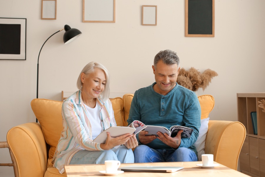 Senior couple reading together to keep memory sharp